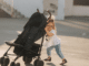 Young child pushing a stroller