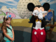 Mickey Mouse signing autographs at Epcot