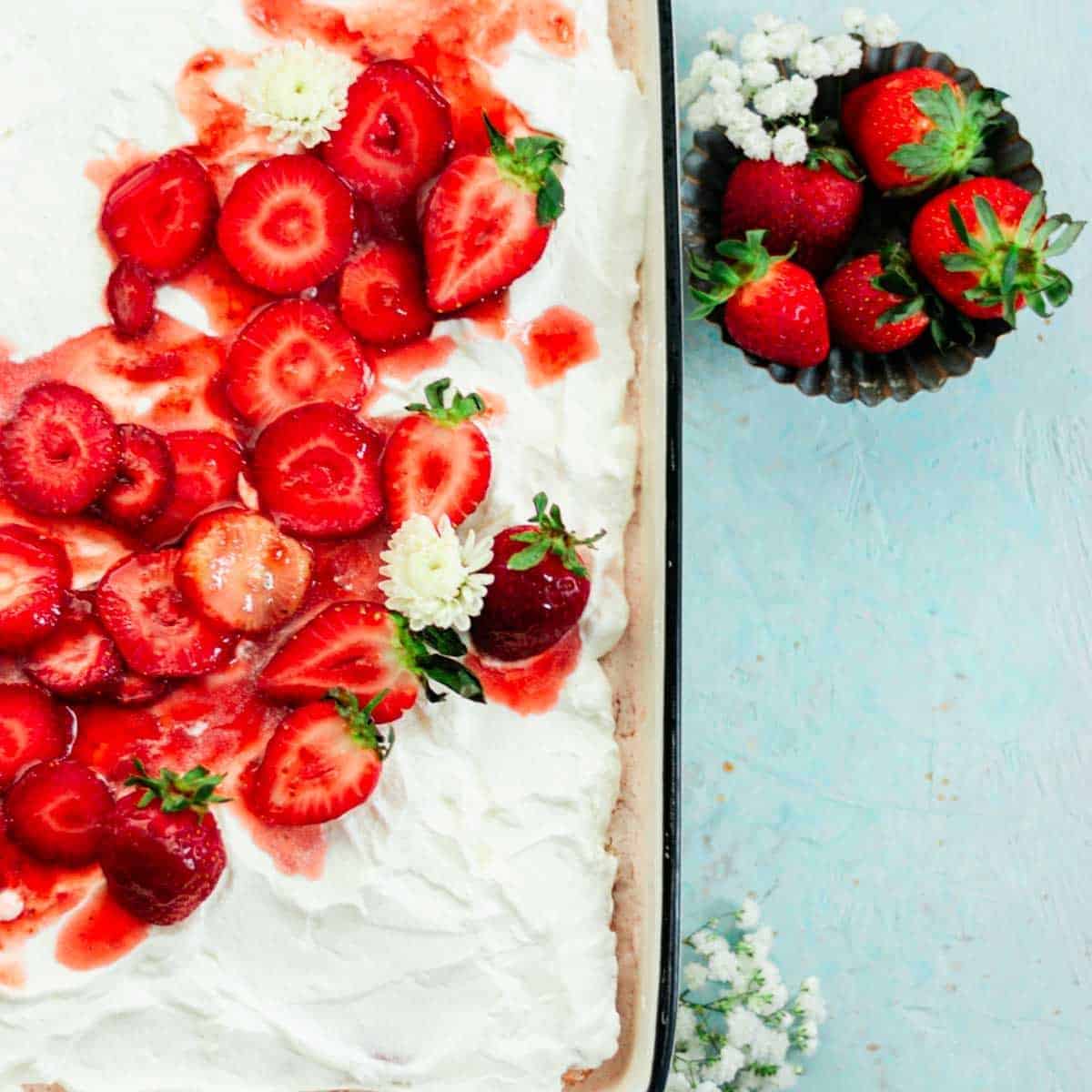 forsting a strawberry Tres Leches cake 124